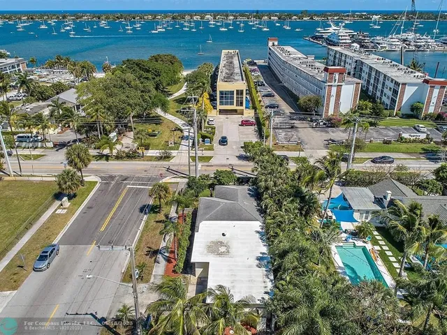 an aerial view of house with yard and outdoor seating