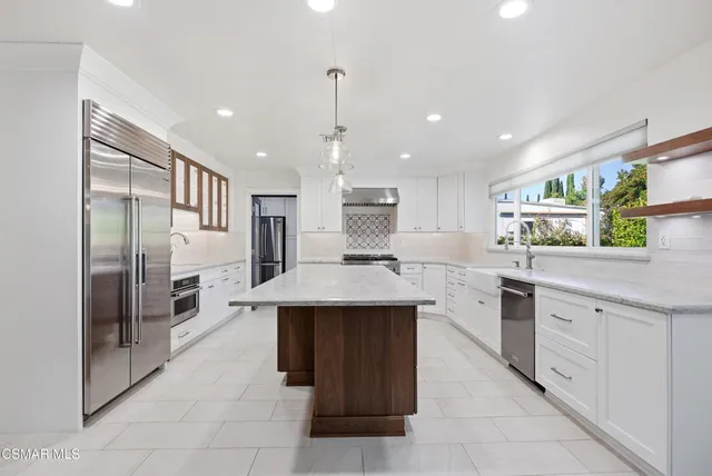 a bathroom with a double vanity sink a mirror and a shower