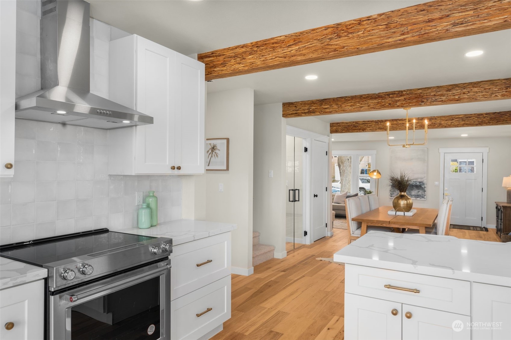 3054 37th Avenue Southwest Seattle, WA 98126 - Photo 12 of 38 a kitchen with stainless steel appliances granite countertop a stove a sink and a refrigerator