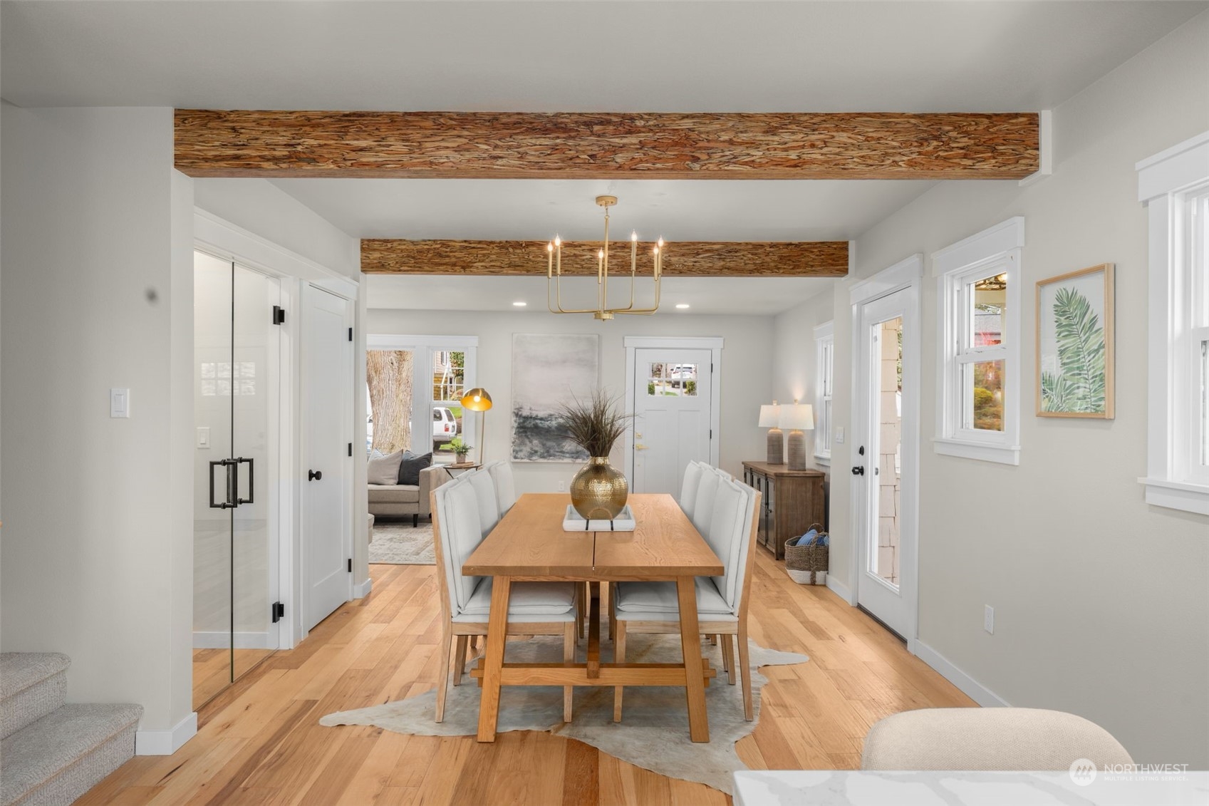 3054 37th Avenue Southwest Seattle, WA 98126 - Photo 15 of 38 a view of a dining room with furniture and wooden floor