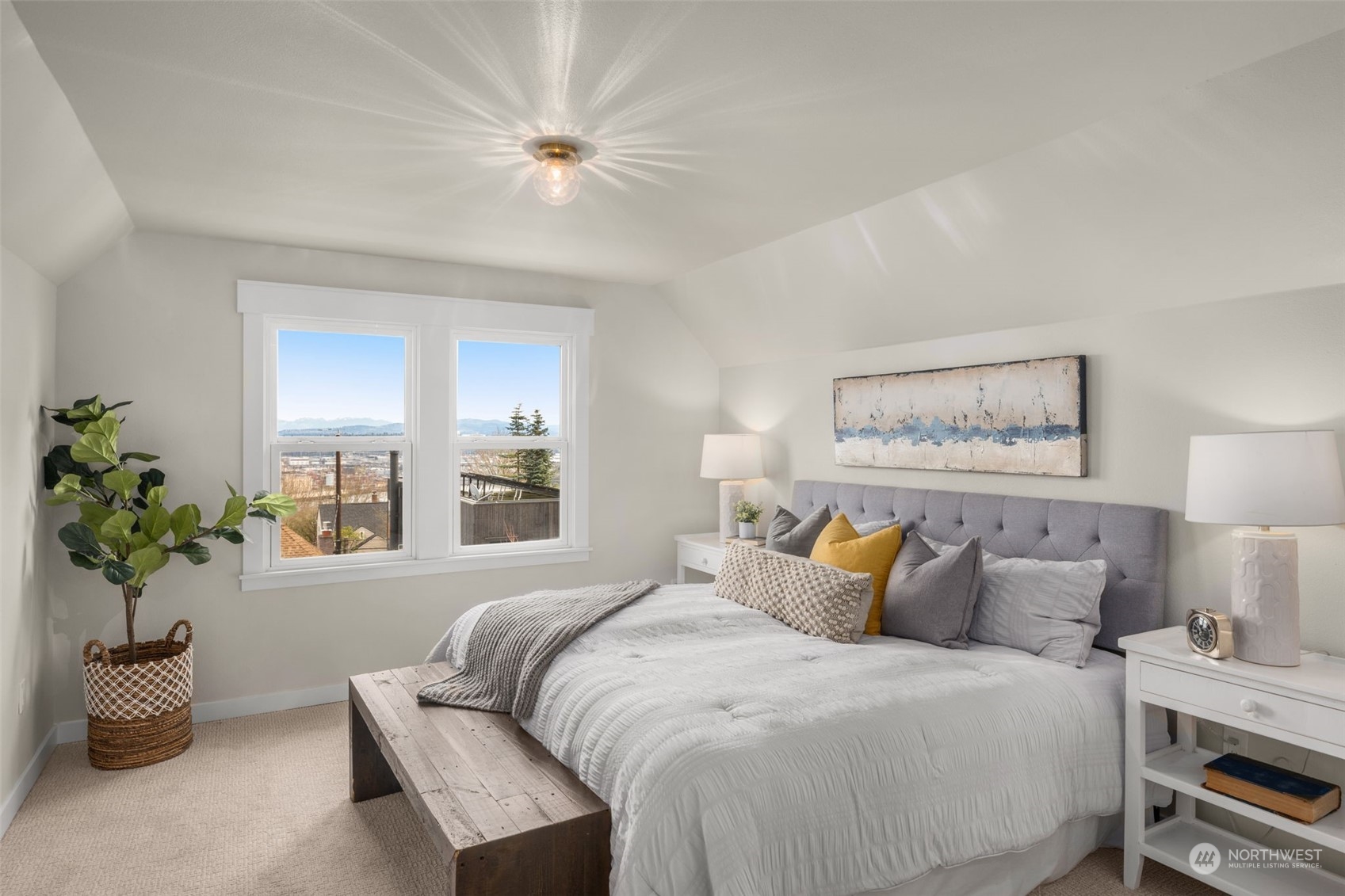 3054 37th Avenue Southwest Seattle, WA 98126 - Photo 18 of 38 a bedroom with a bed and a potted plant