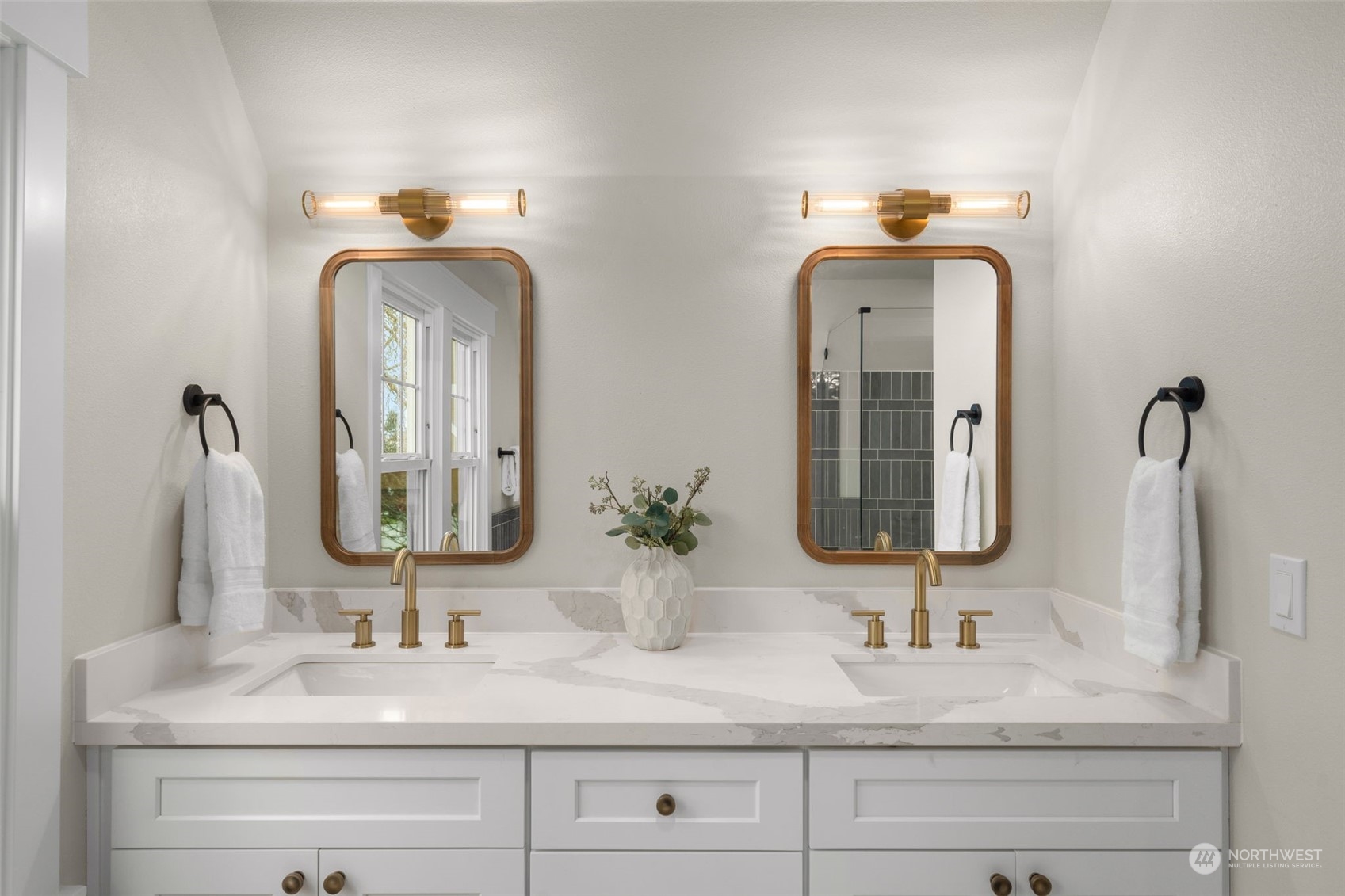 3054 37th Avenue Southwest Seattle, WA 98126 - Photo 22 of 38 a bathroom with double vanity sinks and a mirror