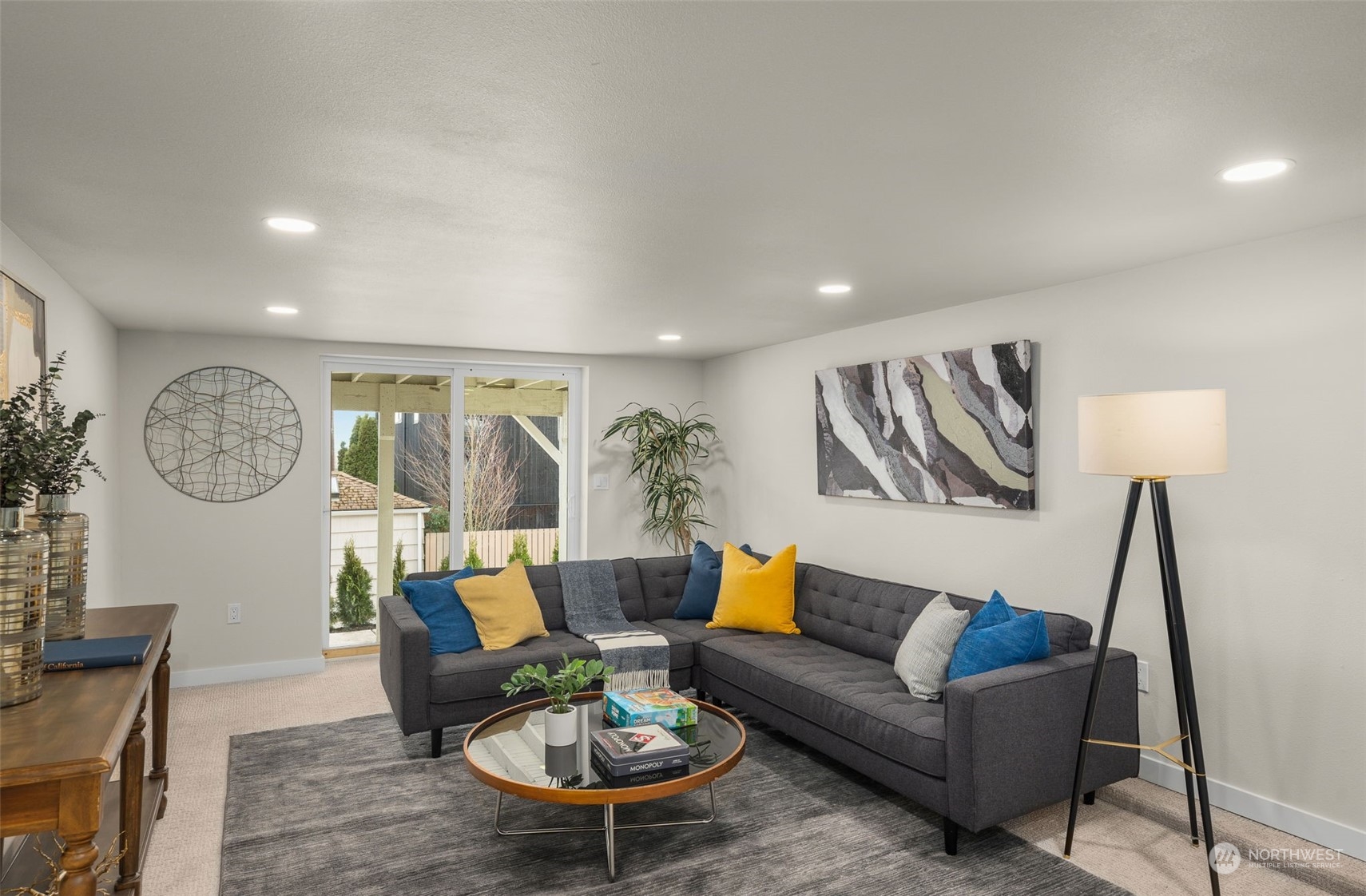 3054 37th Avenue Southwest Seattle, WA 98126 - Photo 24 of 38 a living room with furniture a rug and a wall painting