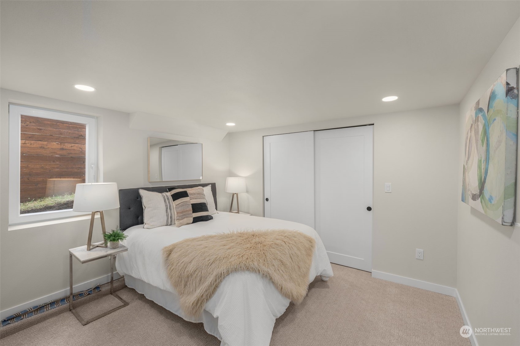 3054 37th Avenue Southwest Seattle, WA 98126 - Photo 26 of 38 a large bedroom with a bed and a window