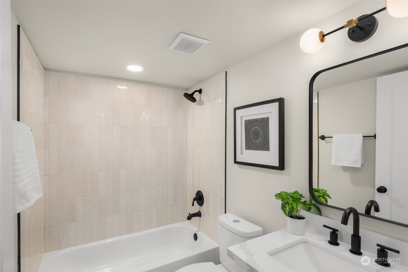 3054 37th Avenue Southwest Seattle, WA 98126 - Photo 28 of 38 a bathroom with a bathtub sink and mirror