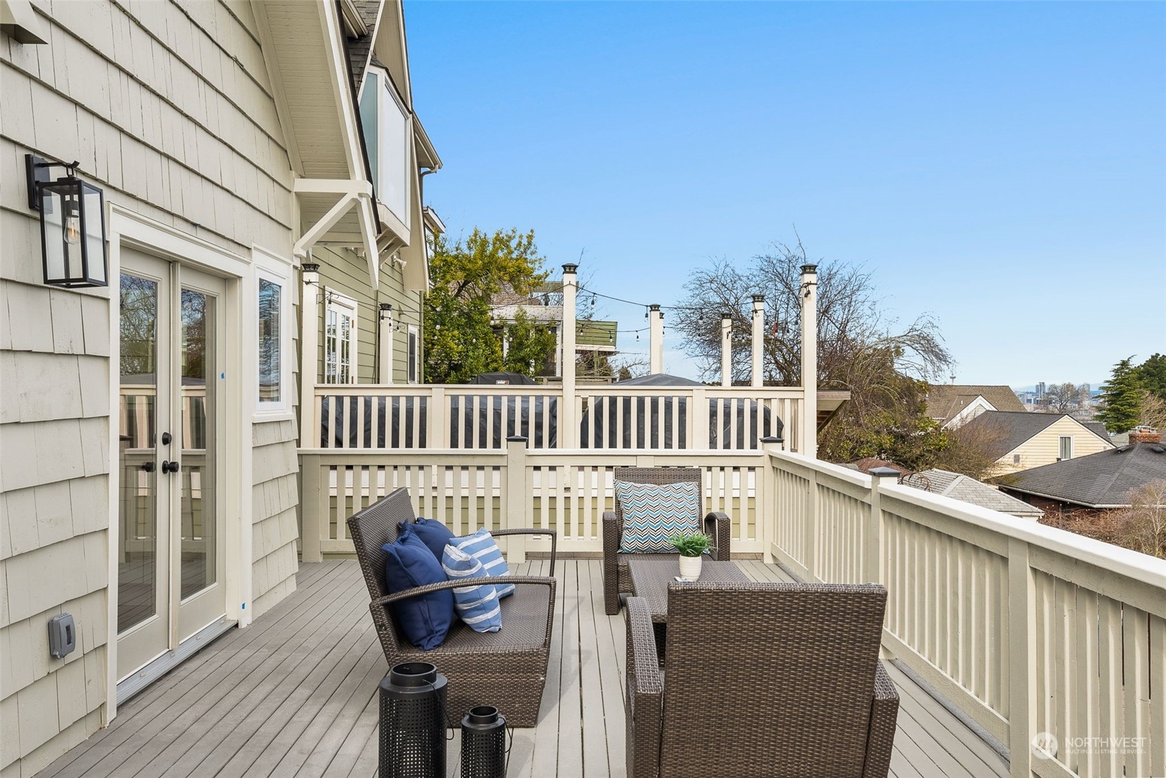 3054 37th Avenue Southwest Seattle, WA 98126 - Photo 31 of 38 a view of a chair and table on the deck