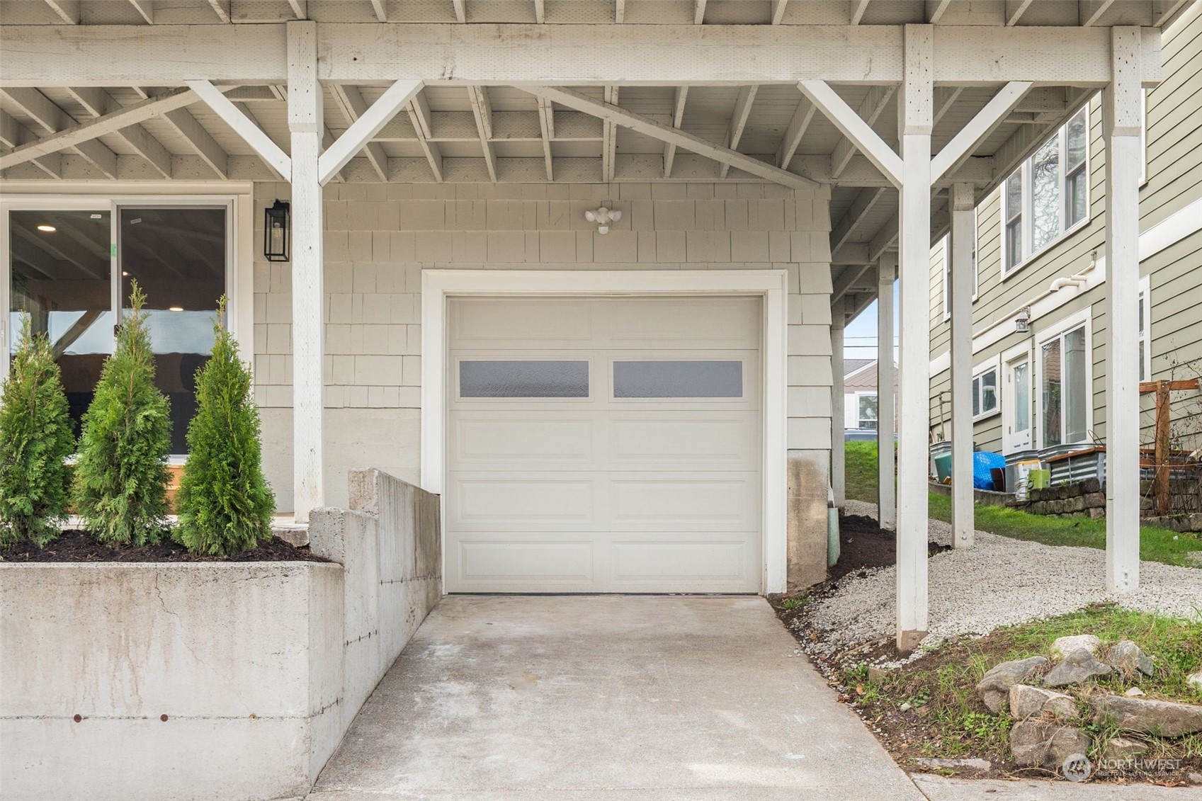 3054 37th Avenue Southwest Seattle, WA 98126 - Photo 33 of 38 a front view of a house with a yard
