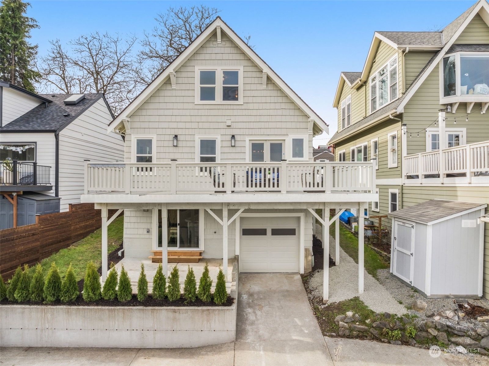 3054 37th Avenue Southwest Seattle, WA 98126 - Photo 34 of 38 a front view of a residential houses with yard