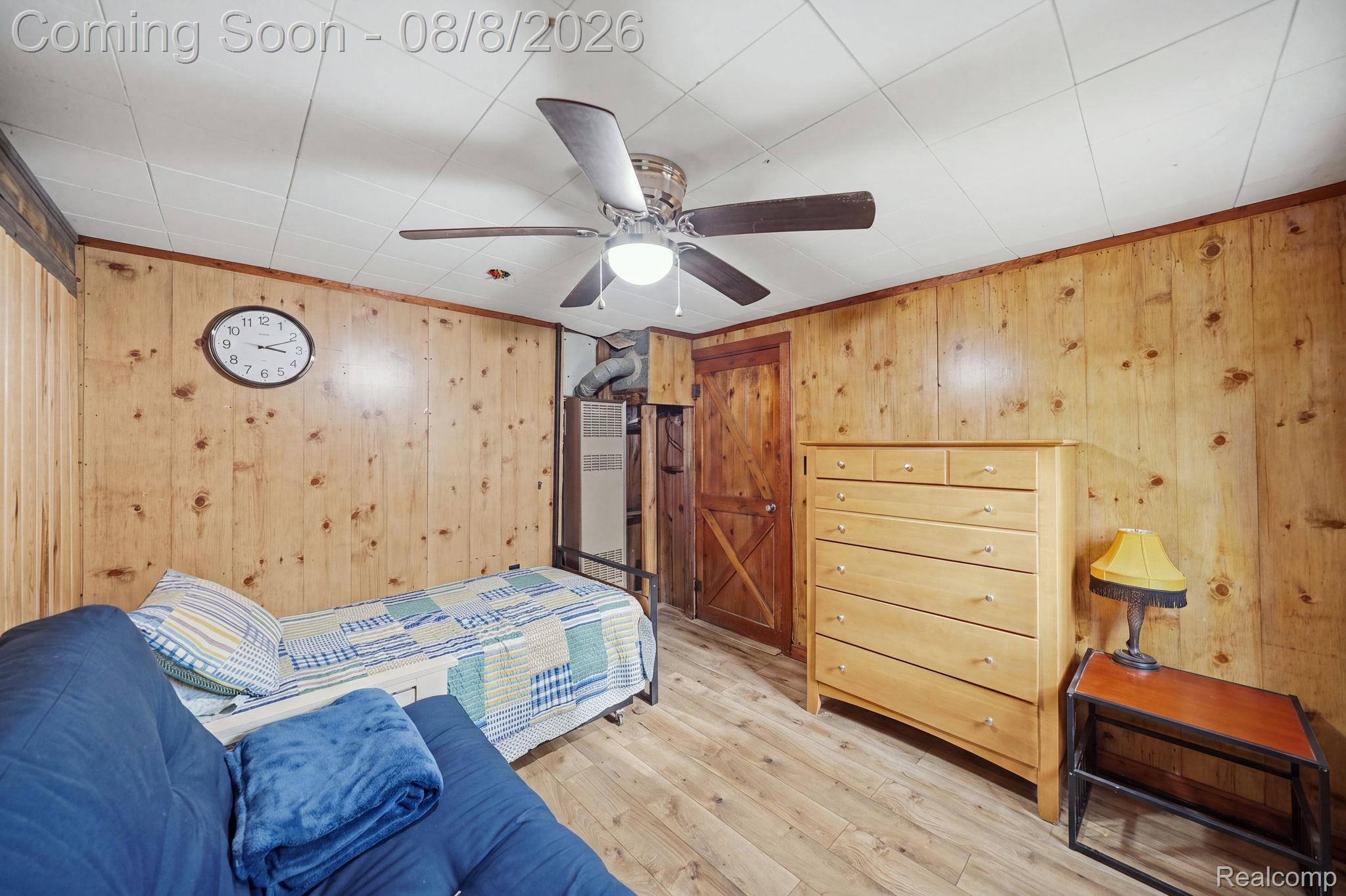 4599 Port Austin Road Caseville, MI 48725 - Photo 20 of 40 Wood-paneled walls with coordinating wood-finish flooring