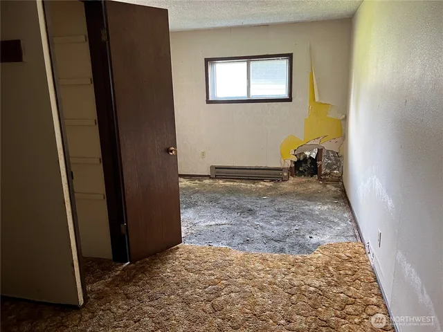 a view of a hallway with wooden shelves