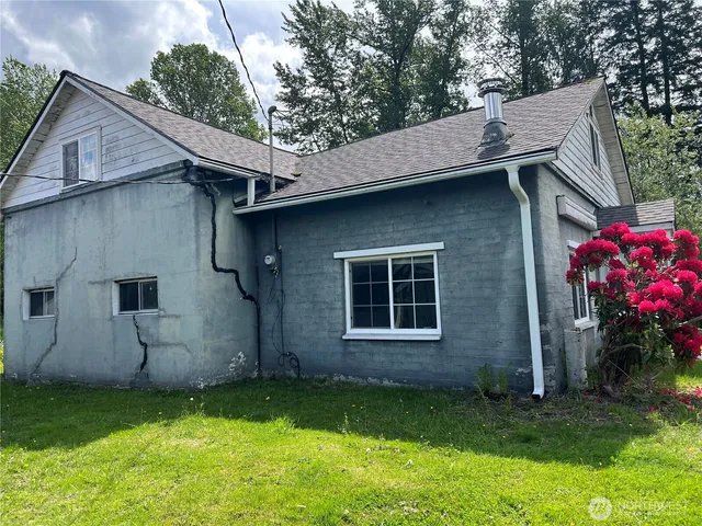 a backyard of a house with lots of green space