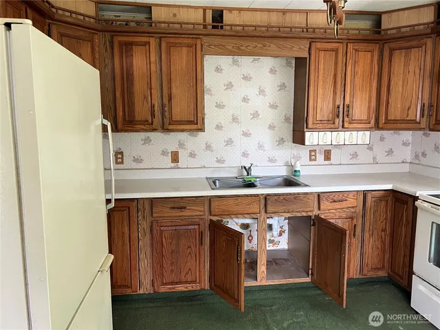 a view of a sink and cabinets
