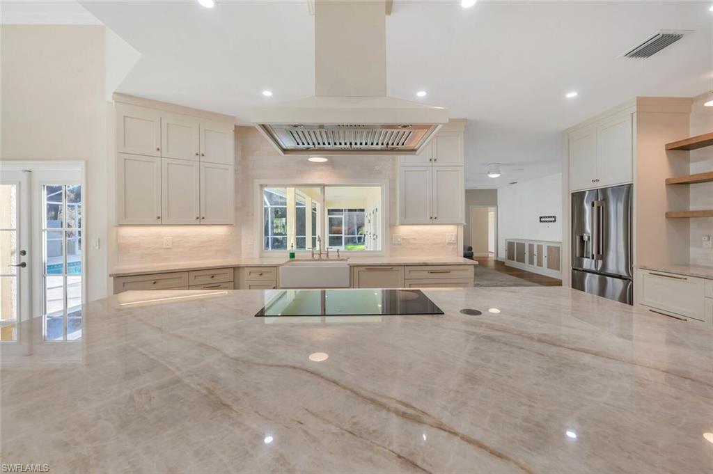 3110 70th Street Southwest Naples, FL 34105 - Photo 15 of 47 a bathroom with a tub shower and bedroom view