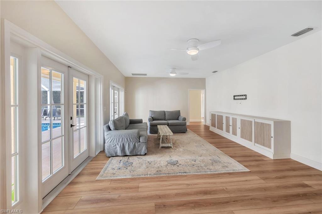 3110 70th Street Southwest Naples, FL 34105 - Photo 19 of 47 a living room with furniture and a table