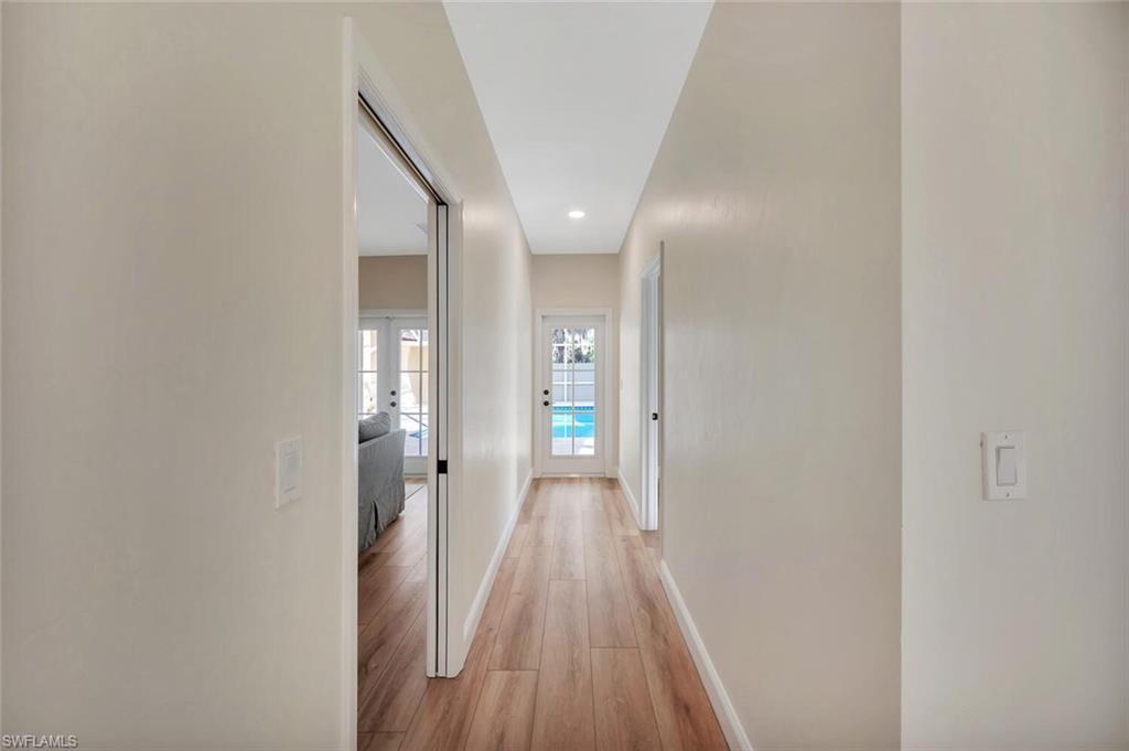 3110 70th Street Southwest Naples, FL 34105 - Photo 28 of 47 a view of a hallway with wooden floor