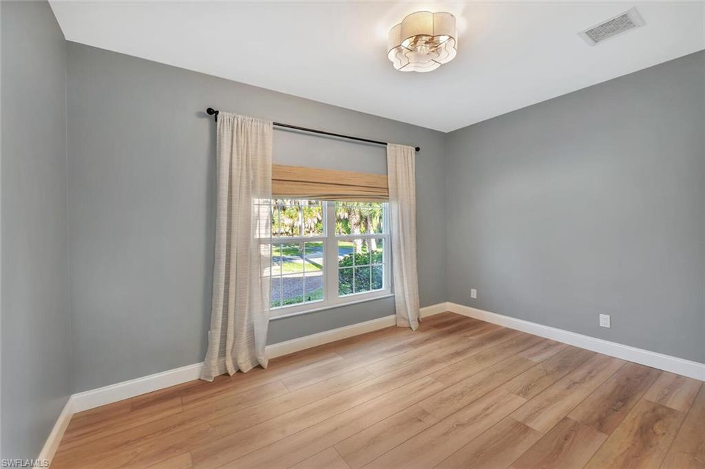 3110 70th Street Southwest Naples, FL 34105 - Photo 37 of 47 a view of an empty room with a window