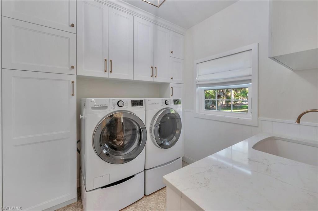 3110 70th Street Southwest Naples, FL 34105 - Photo 38 of 47 a utility room with sink dryer and washer