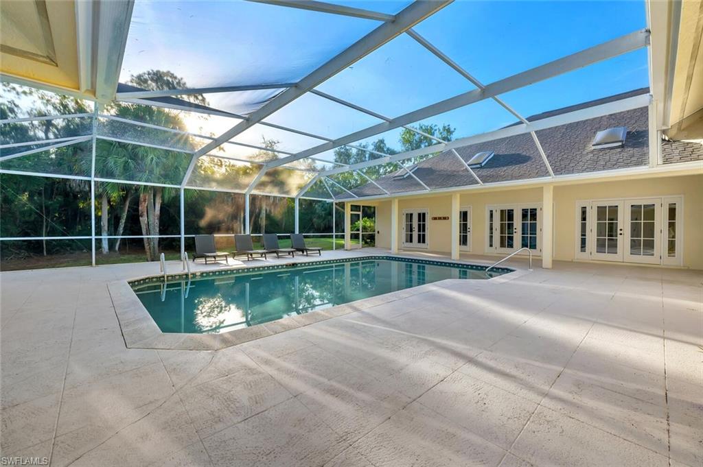 3110 70th Street Southwest Naples, FL 34105 - Photo 40 of 47 a view of swimming pool with outdoor seating