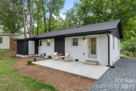 a backyard of a house with seating space
