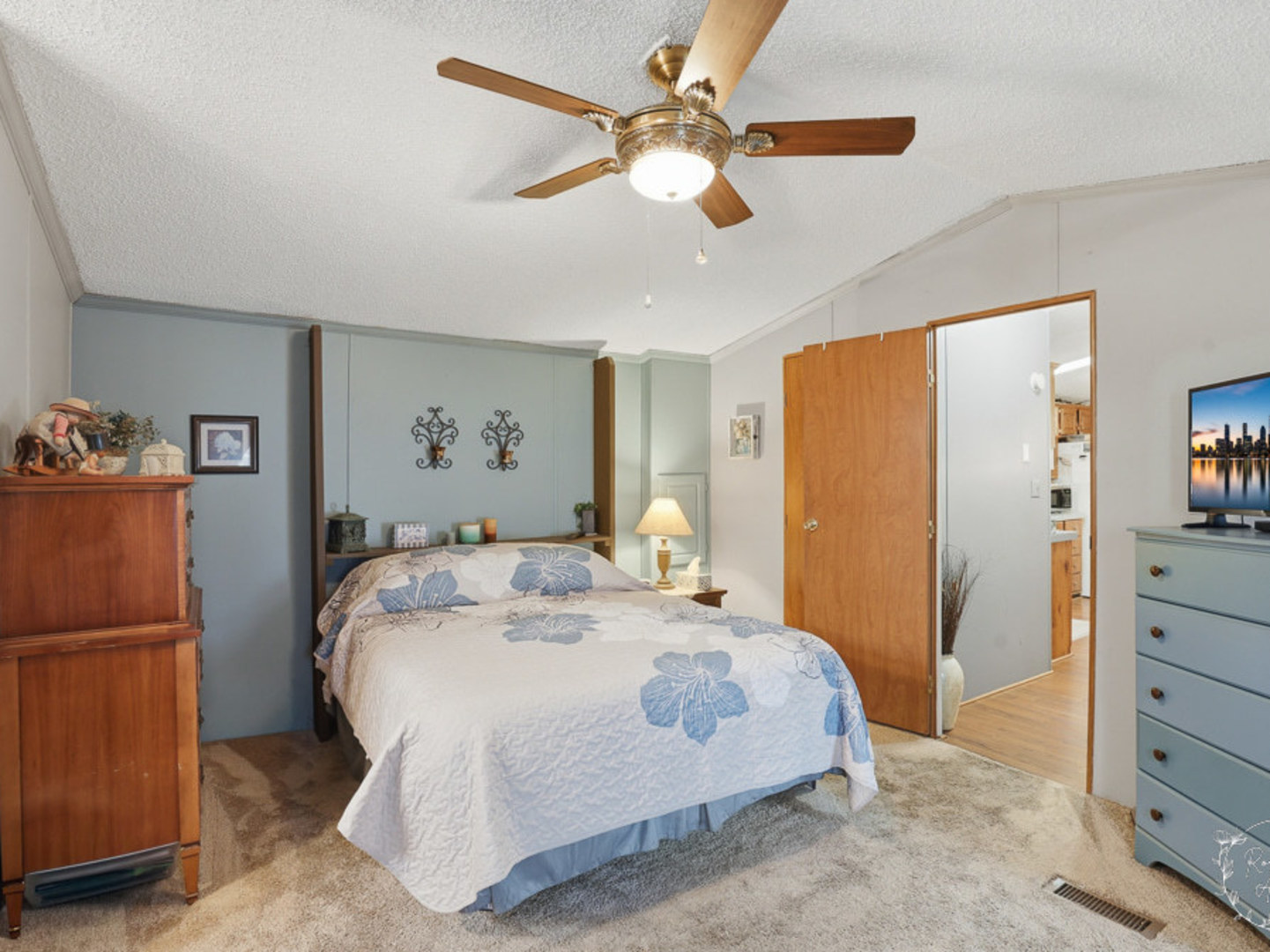 52 Partridge Lane Beecher, IL 60401 - Photo 16 of 24 a spacious bedroom with a bed and a chandelier