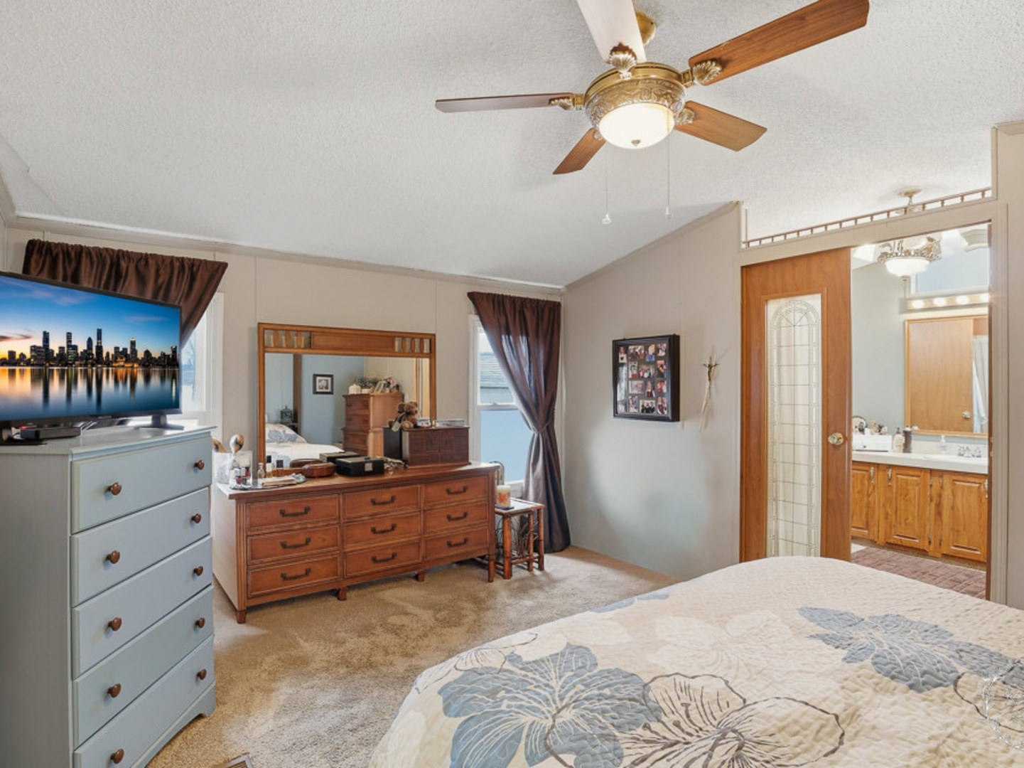 52 Partridge Lane Beecher, IL 60401 - Photo 17 of 24 a bedroom with a bed and a chandelier