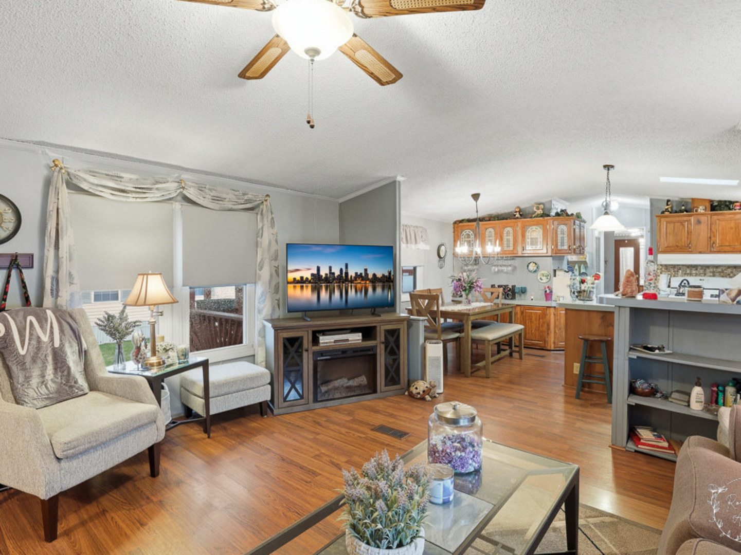 52 Partridge Lane Beecher, IL 60401 - Photo 4 of 24 a living room with fireplace furniture and a kitchen view