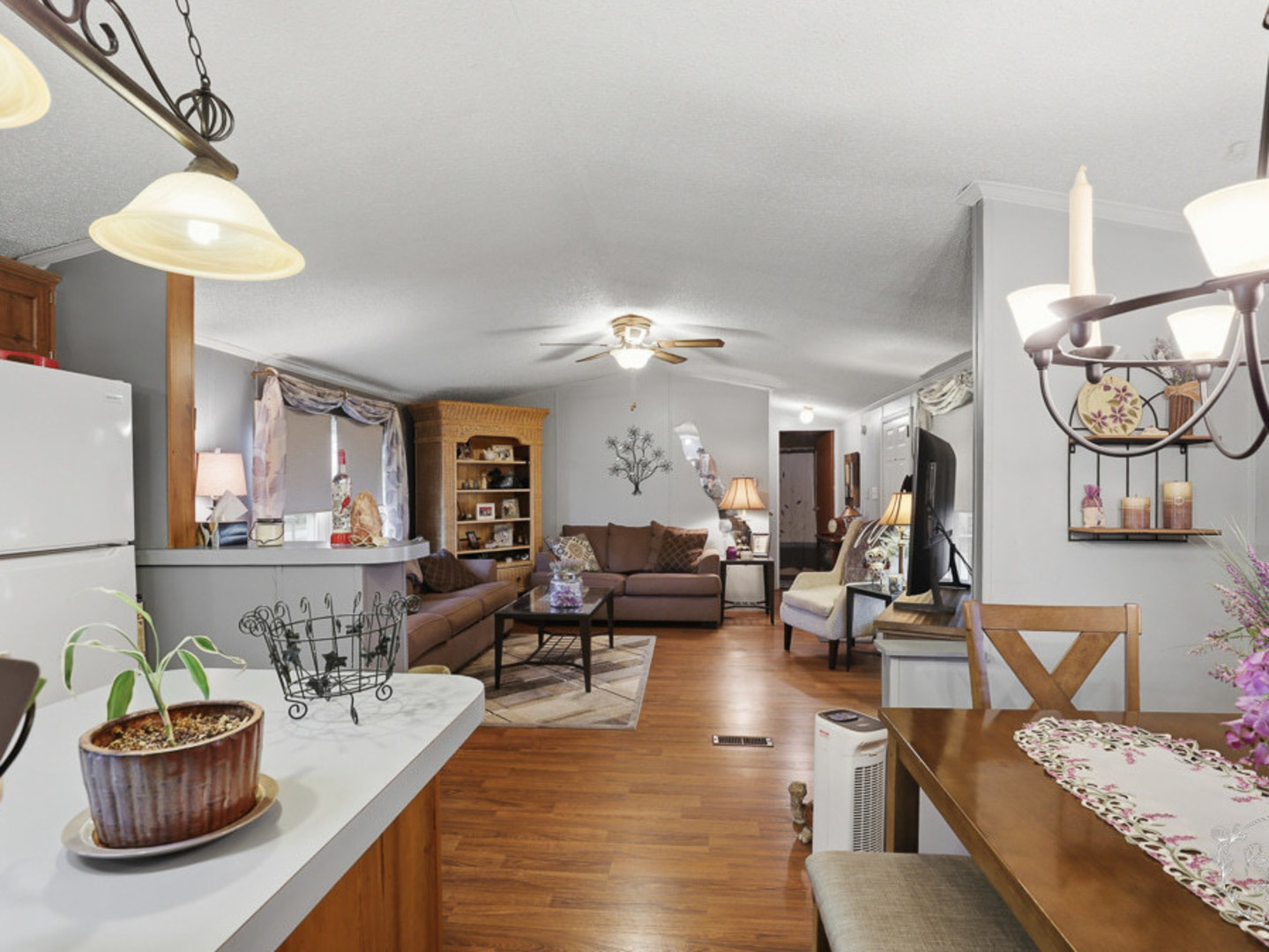 52 Partridge Lane Beecher, IL 60401 - Photo 8 of 24 a living room with furniture and a chandelier