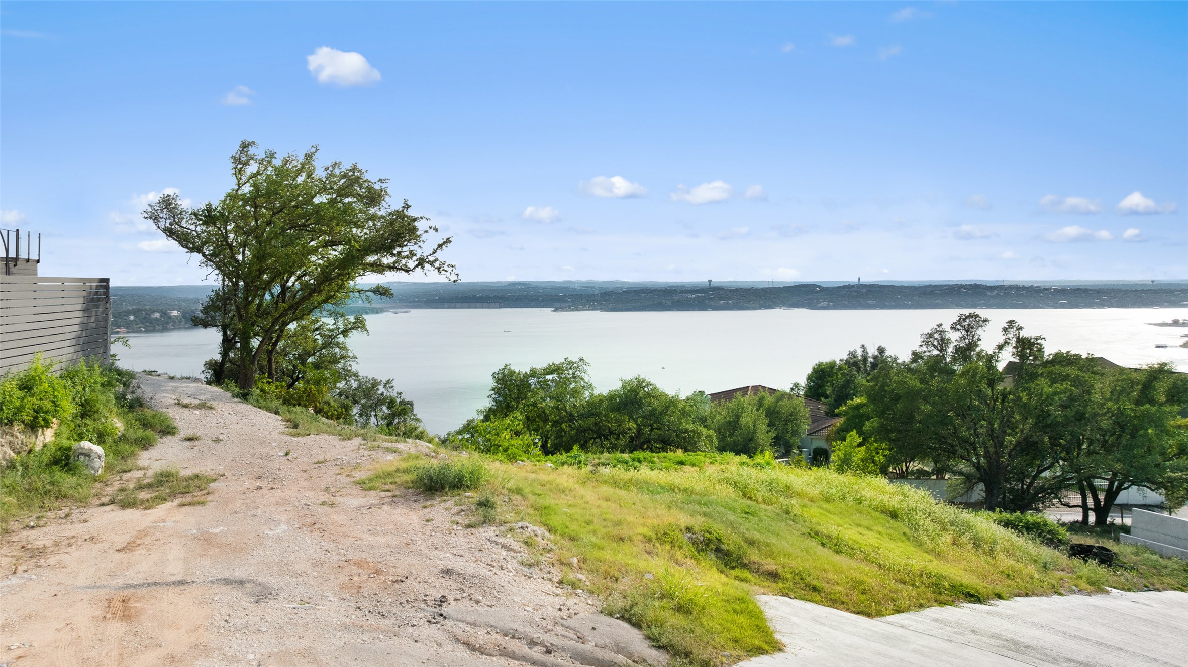 6813 Oasis Pass Austin, TX 78732 - Photo 15 of 36 a view of a lake with a mountain in the background