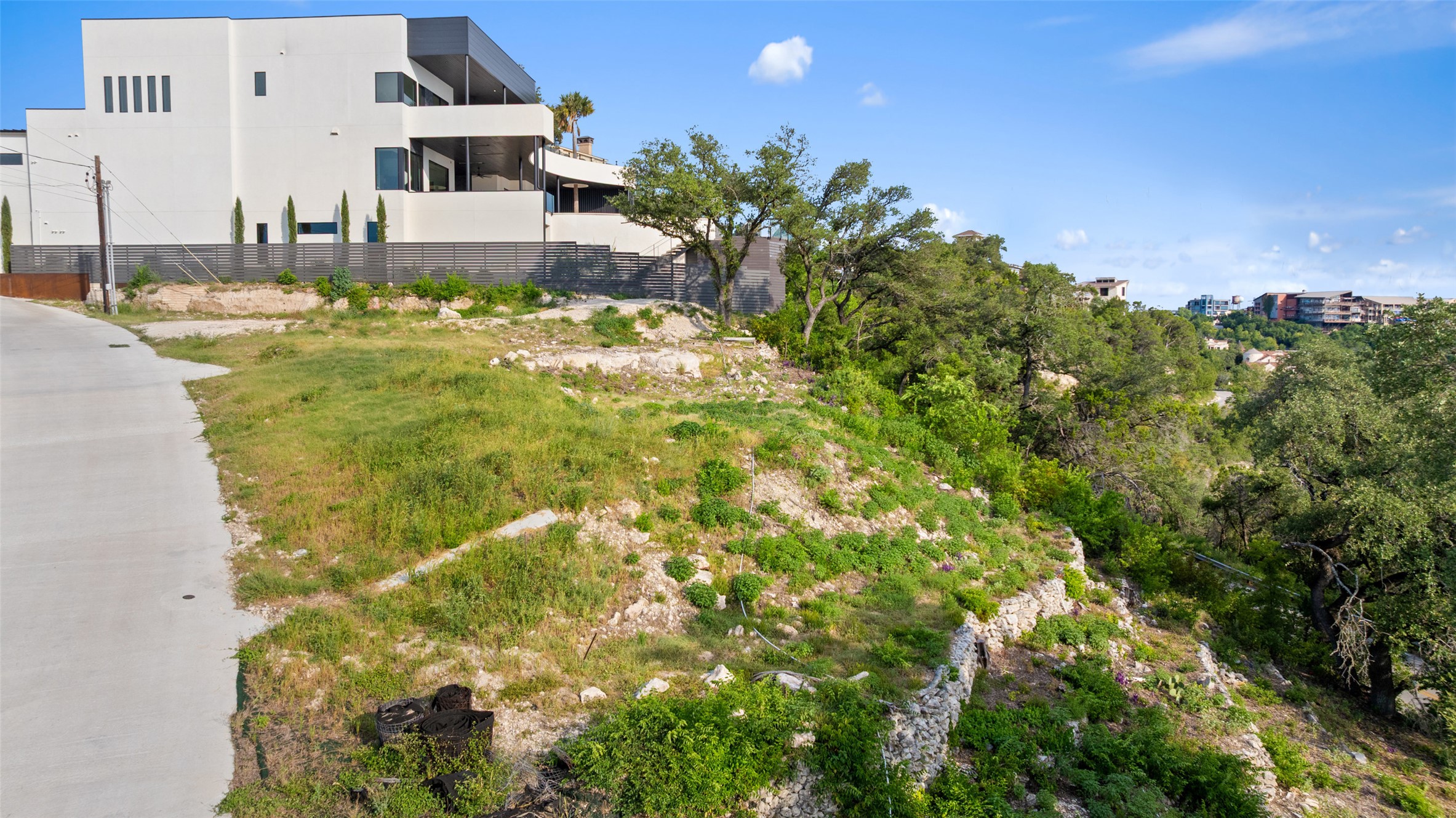 6813 Oasis Pass Austin, TX 78732 - Photo 16 of 36 a view of a house with a yard
