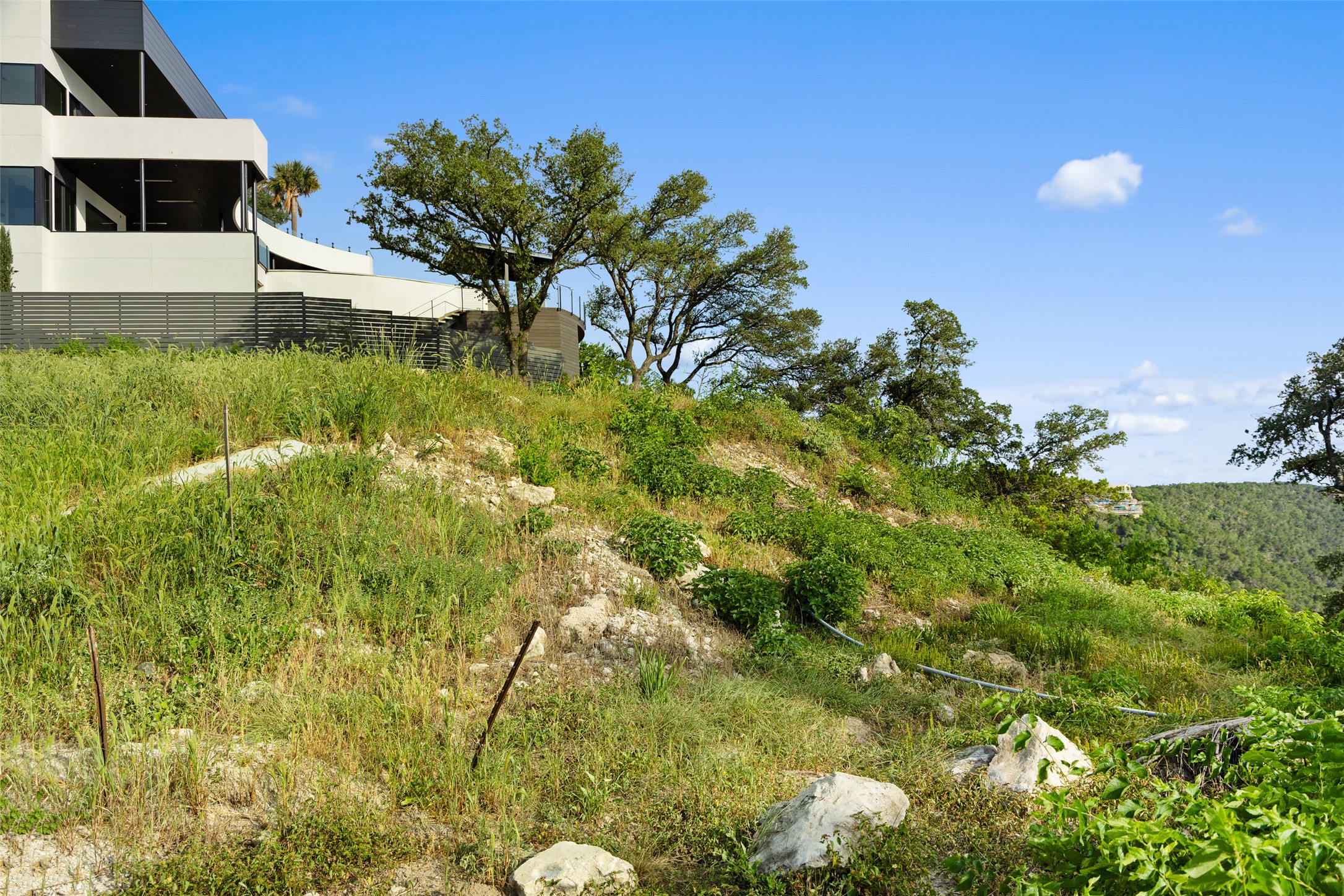 6813 Oasis Pass Austin, TX 78732 - Photo 24 of 36 a view of an outdoor space and a yard