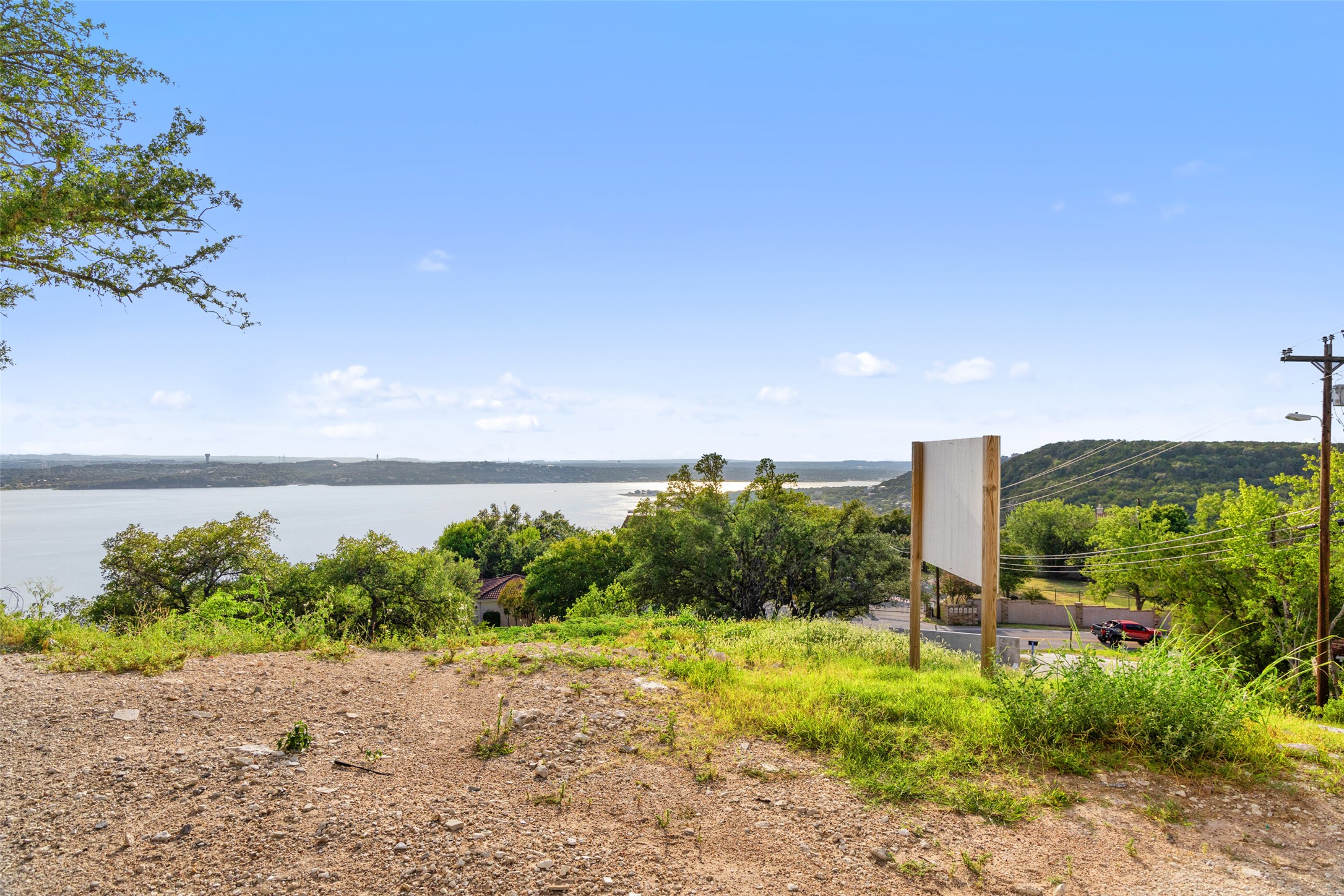 6813 Oasis Pass Austin, TX 78732 - Photo 28 of 36 a view of a lake with beach