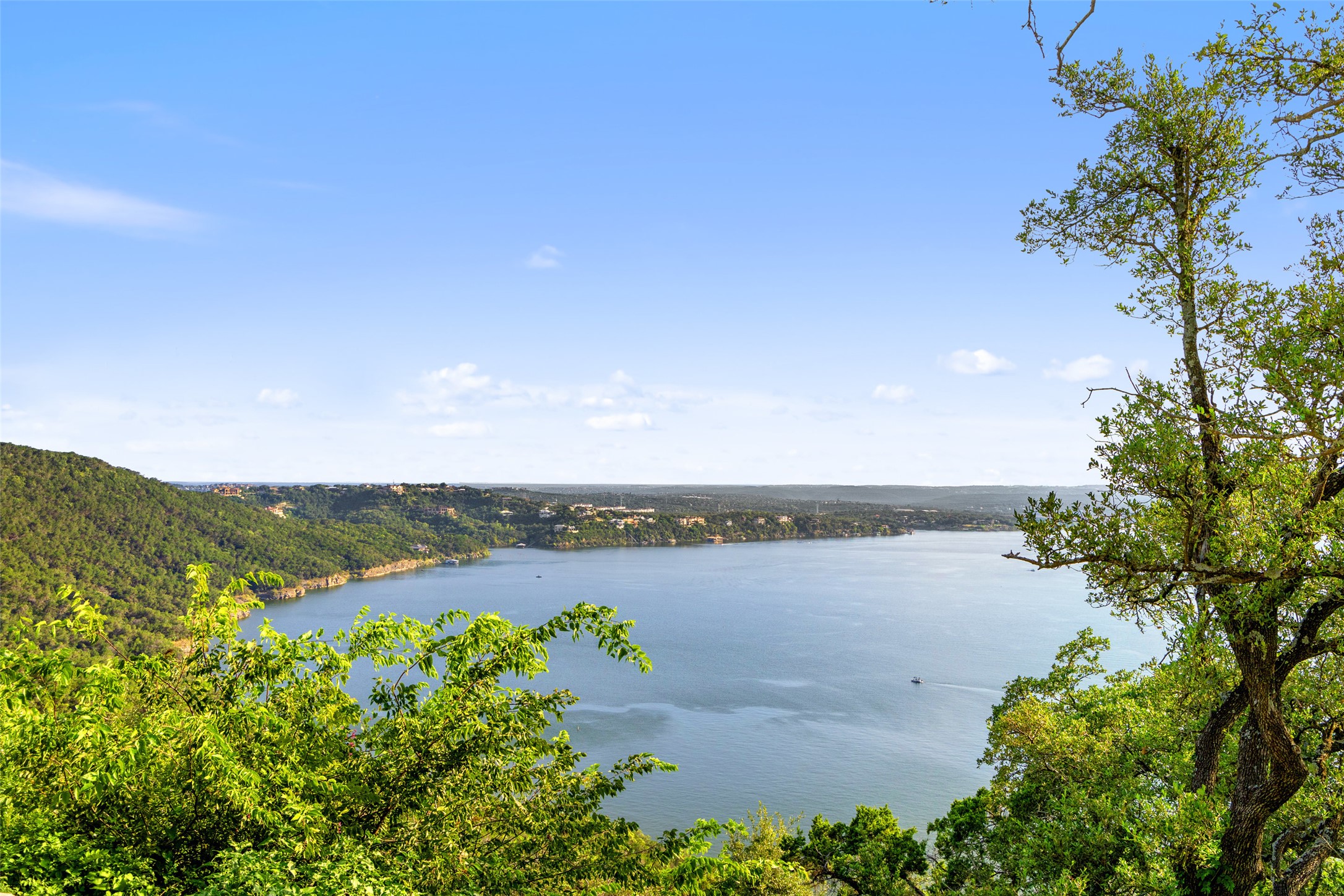 6813 Oasis Pass Austin, TX 78732 - Photo 30 of 36 a view of a lake with houses in the back