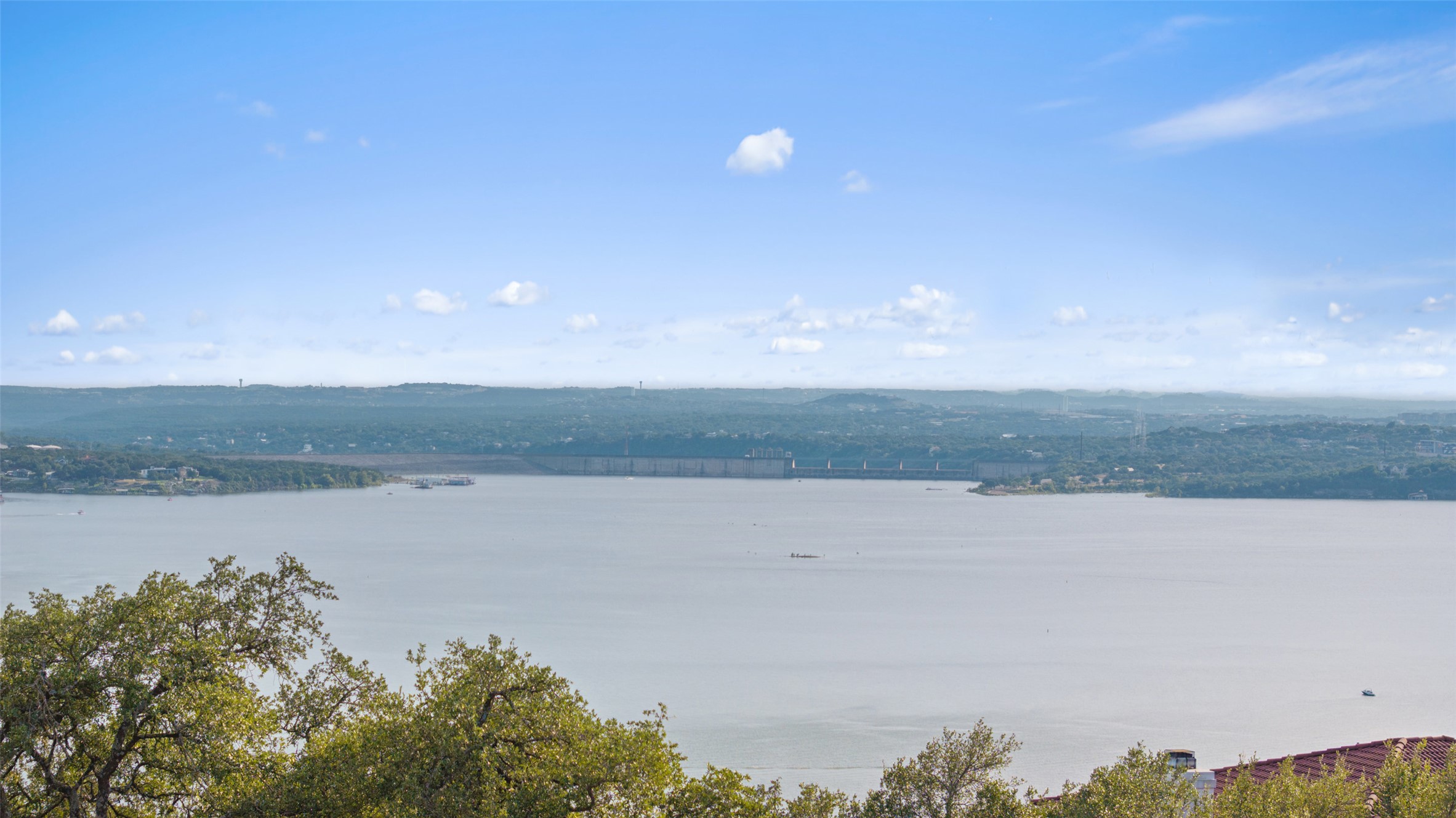 6813 Oasis Pass Austin, TX 78732 - Photo 35 of 36 a view of a lake with a beach