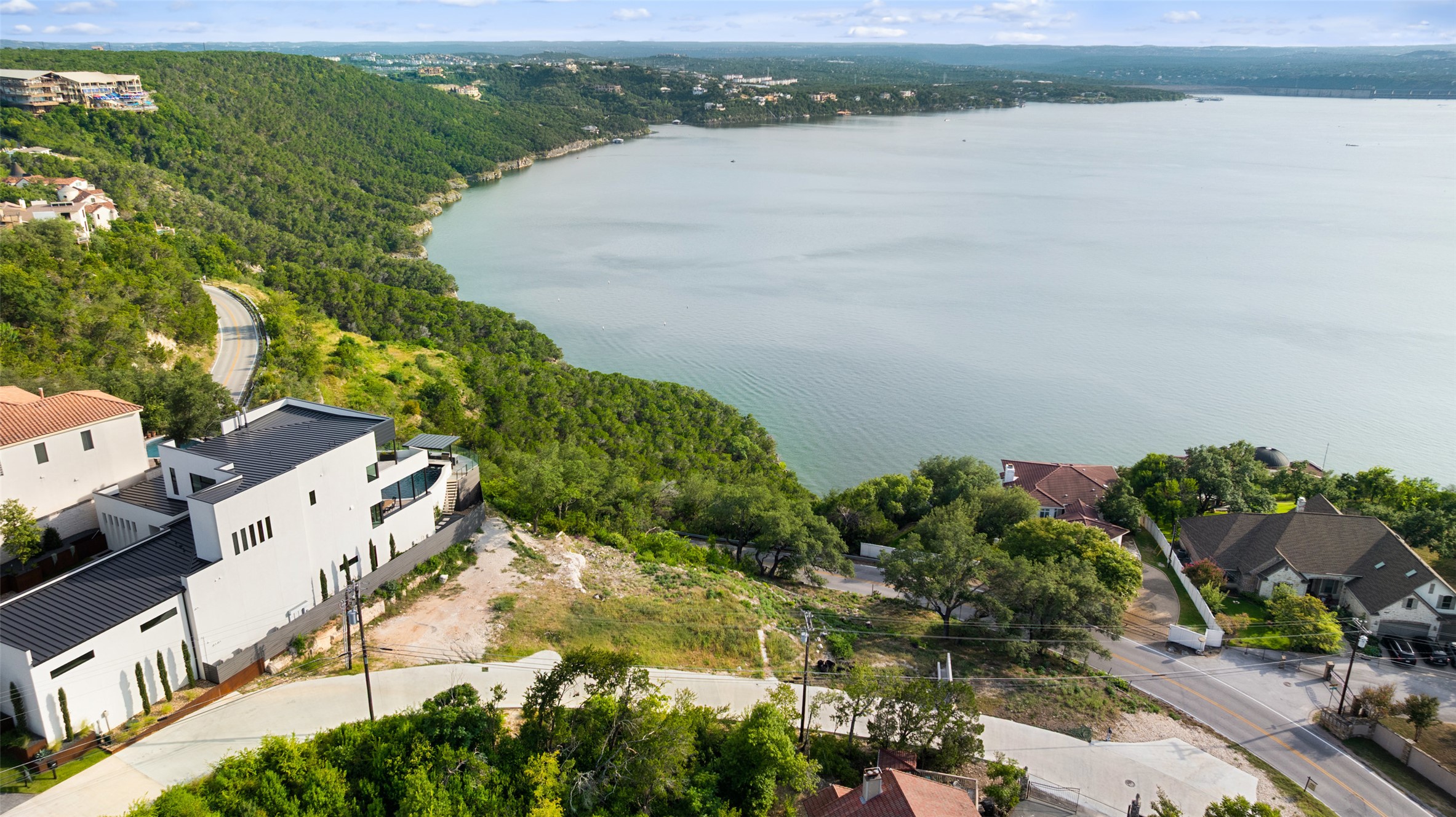 6813 Oasis Pass Austin, TX 78732 - Photo 5 of 36 an aerial view of a house with a lake view