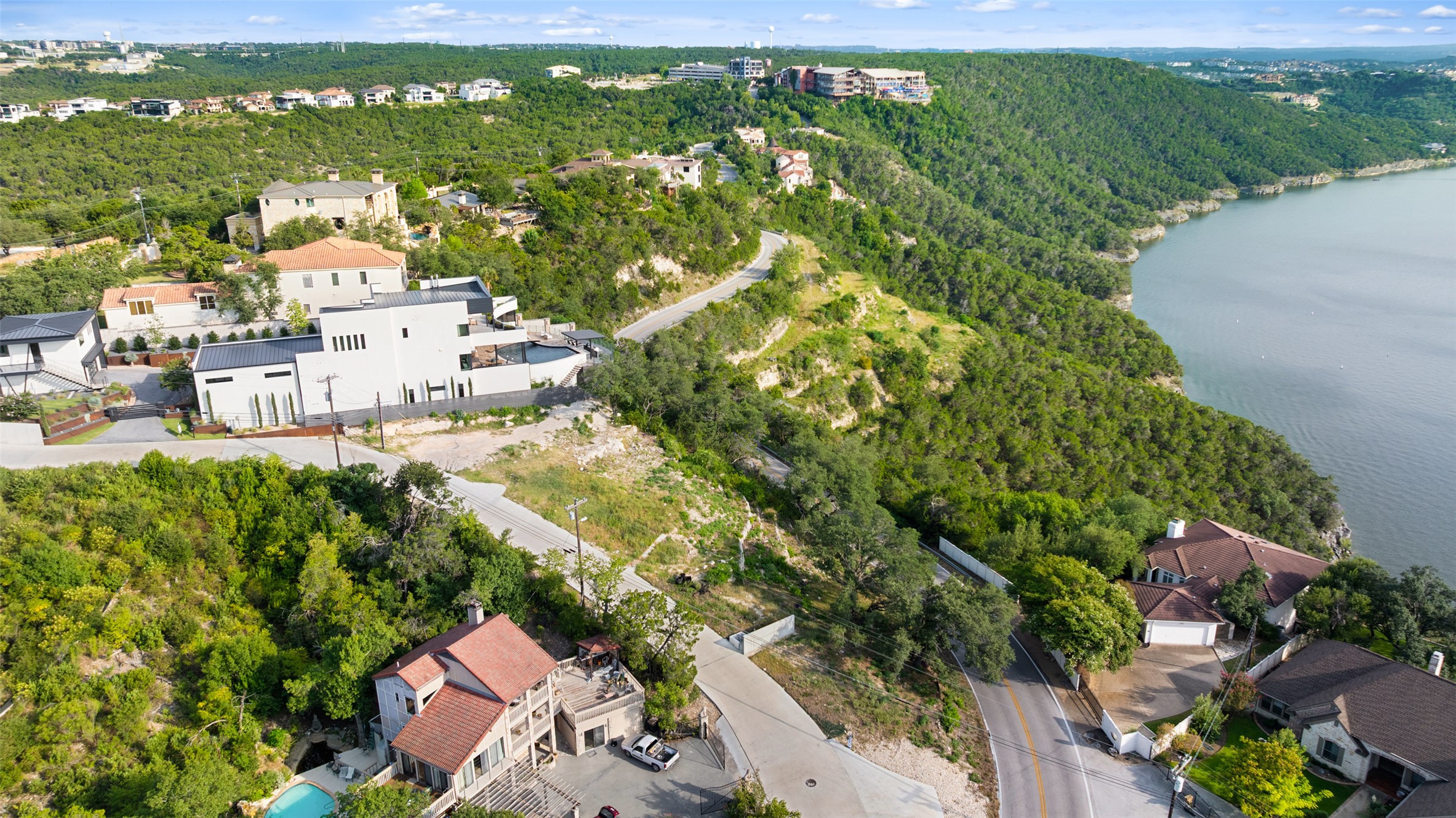 6813 Oasis Pass Austin, TX 78732 - Photo 7 of 36 an aerial view of residential houses with outdoor space and trees