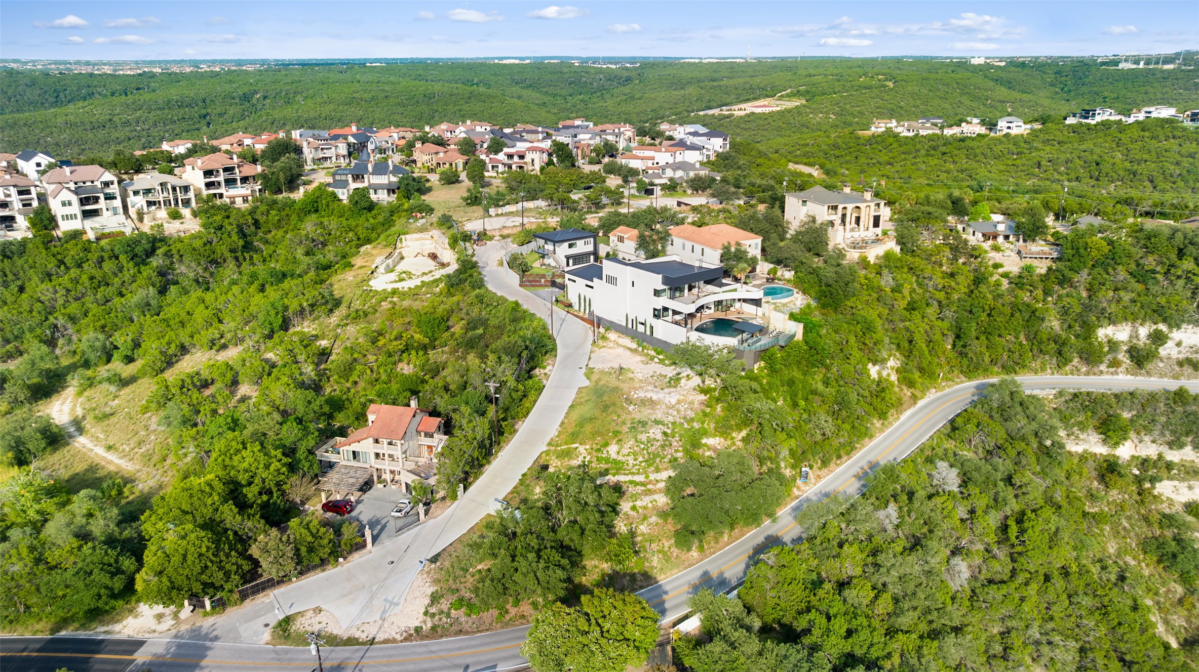 6813 Oasis Pass Austin, TX 78732 - Photo 8 of 36 a view of a lake with a city view