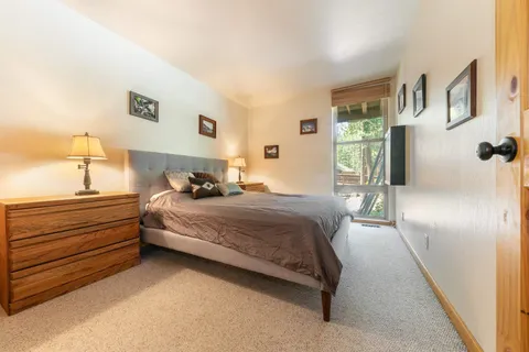 a bedroom with a bed and lamp