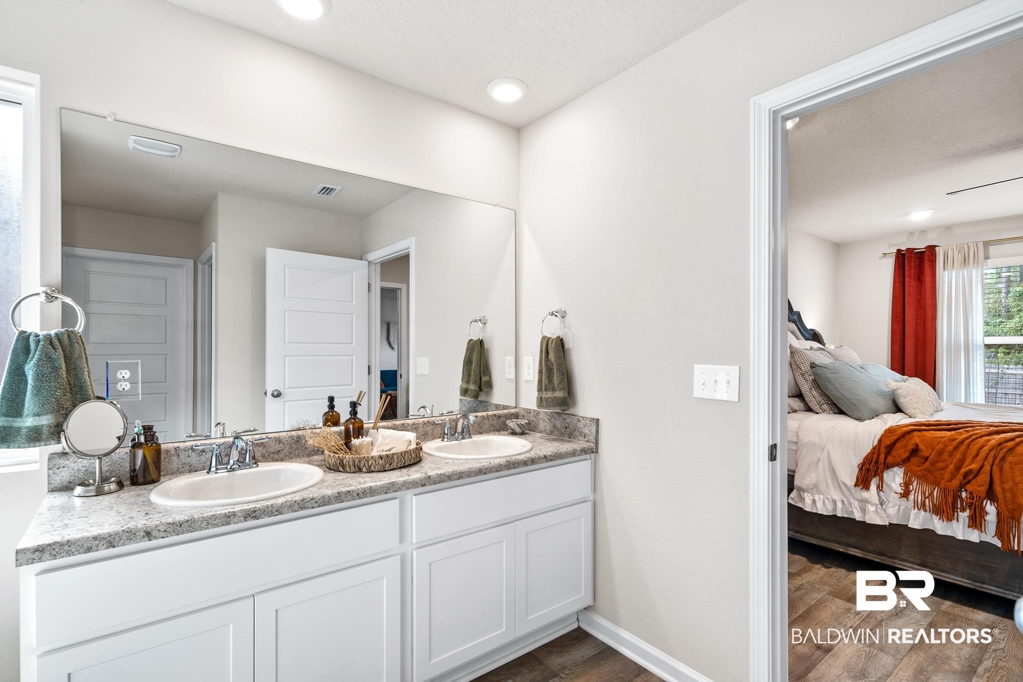 10516 Brodick Loop Daphne, AL 36527 - Photo 16 of 27 Bathroom with vanity, a textured ceiling, and wood-type flooring