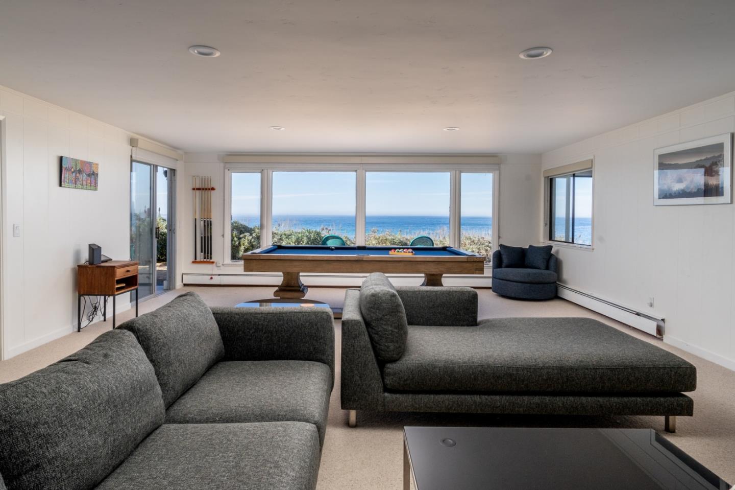 2715 Ribera Road Carmel, CA 93923 - Photo 24 of 41 a living room with furniture and a large window