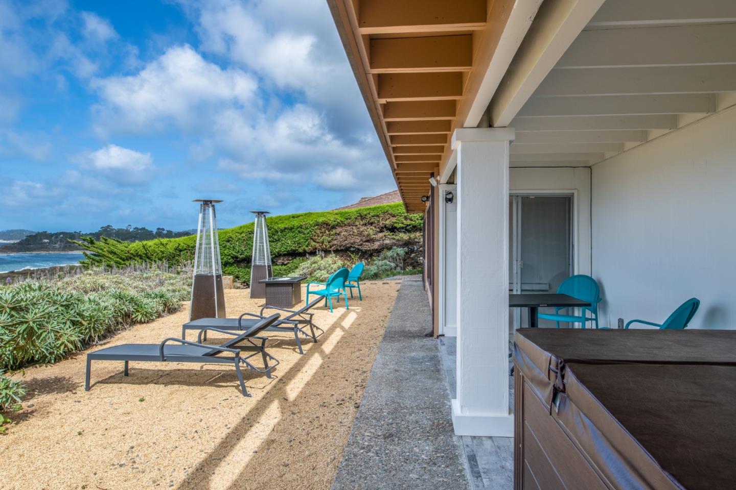2715 Ribera Road Carmel, CA 93923 - Photo 32 of 41 a view of a patio with a table and chairs