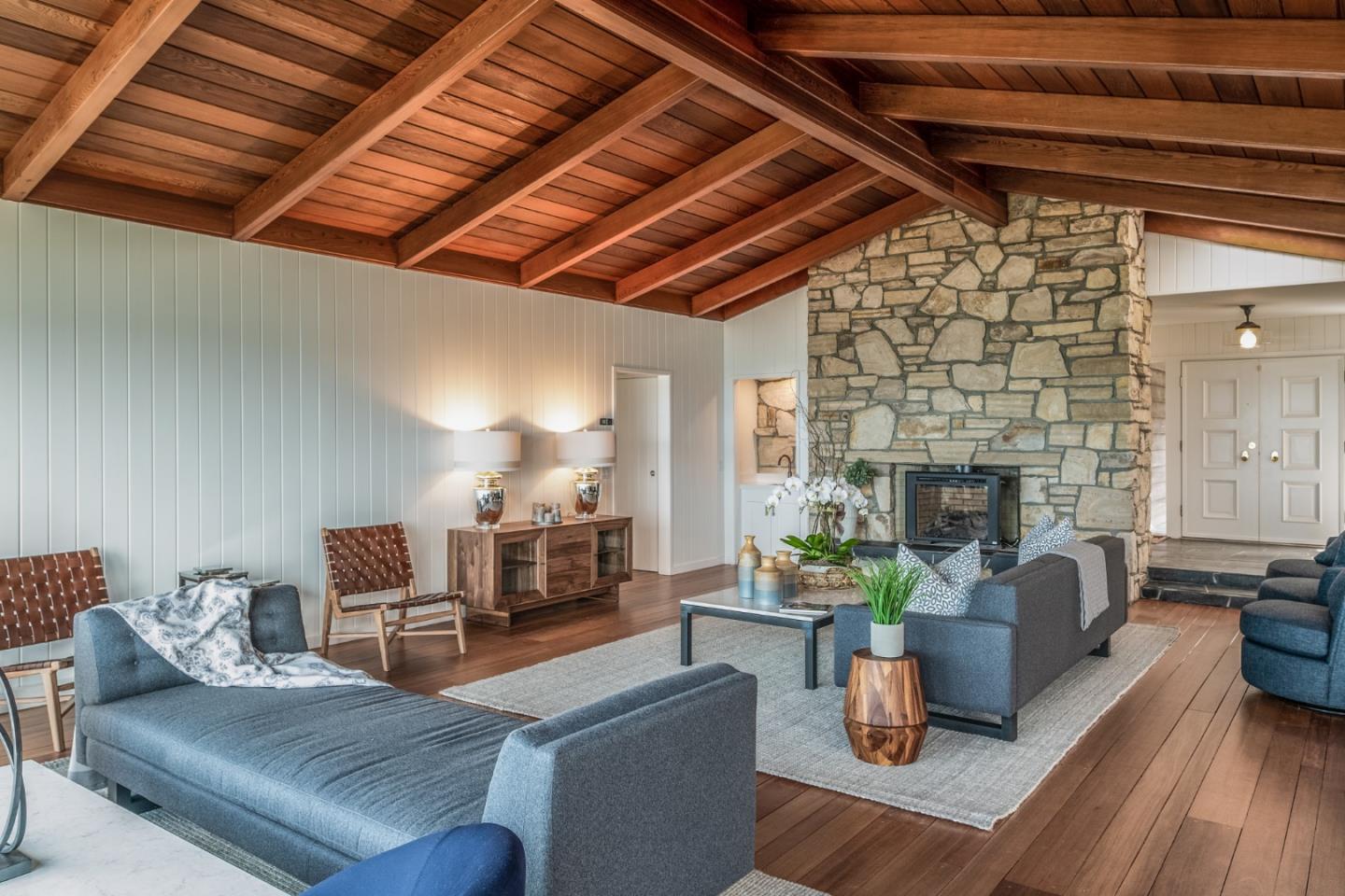 2715 Ribera Road Carmel, CA 93923 - Photo 10 of 41 a living room with furniture and a fireplace