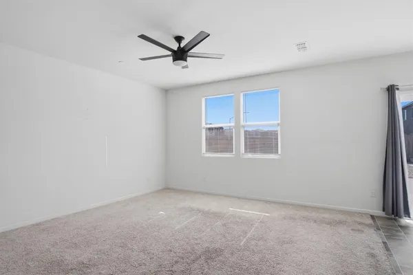 a view of a big room with wooden floor closet and windows