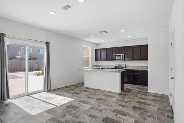 a kitchen with a refrigerator and a sink