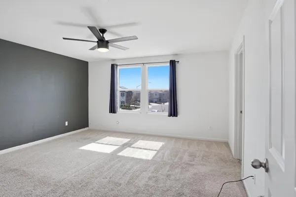 a view of an empty room with a window