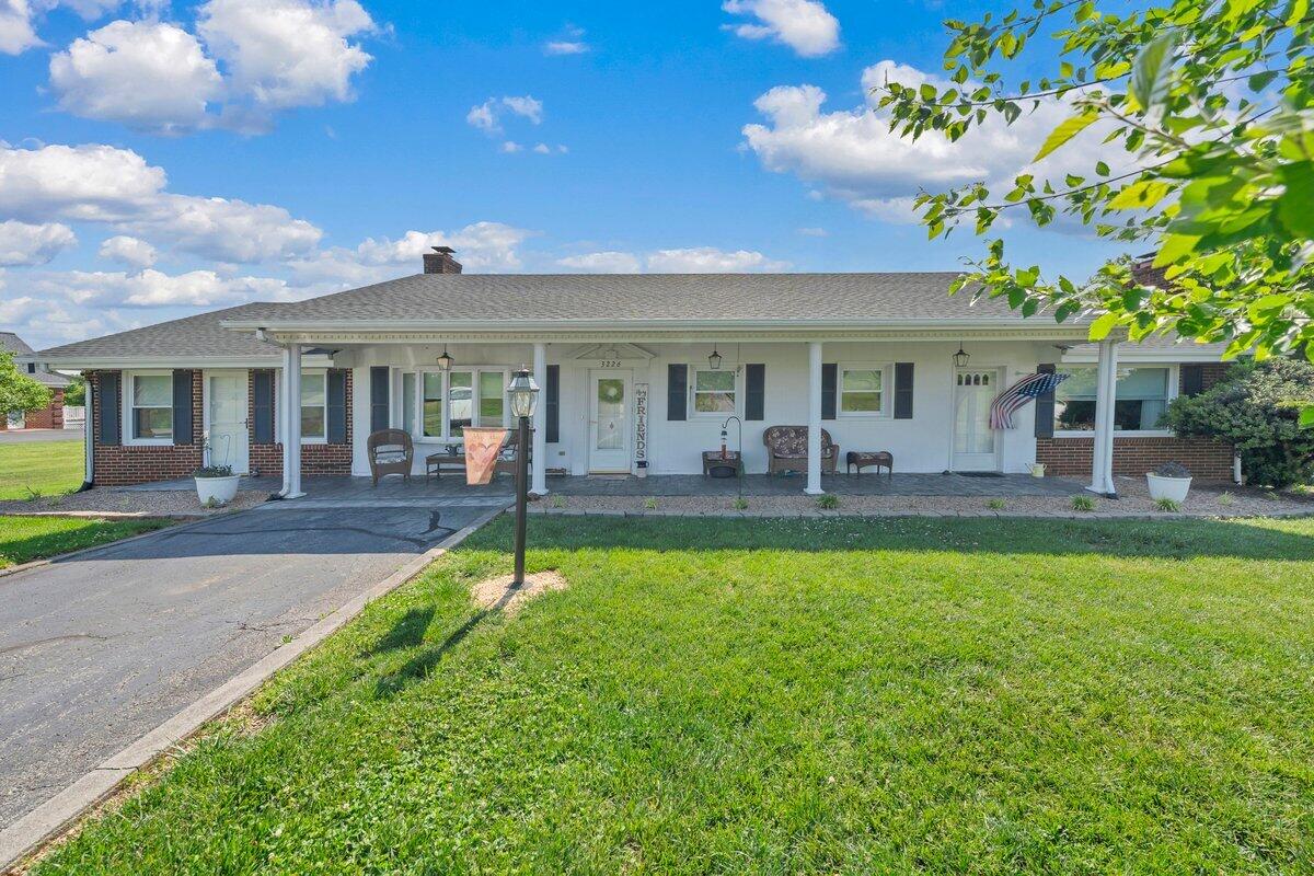 3226 Rakes Road Rocky Mount, VA 24151 - Photo 2 of 74 a view of a house with swimming pool and a yard