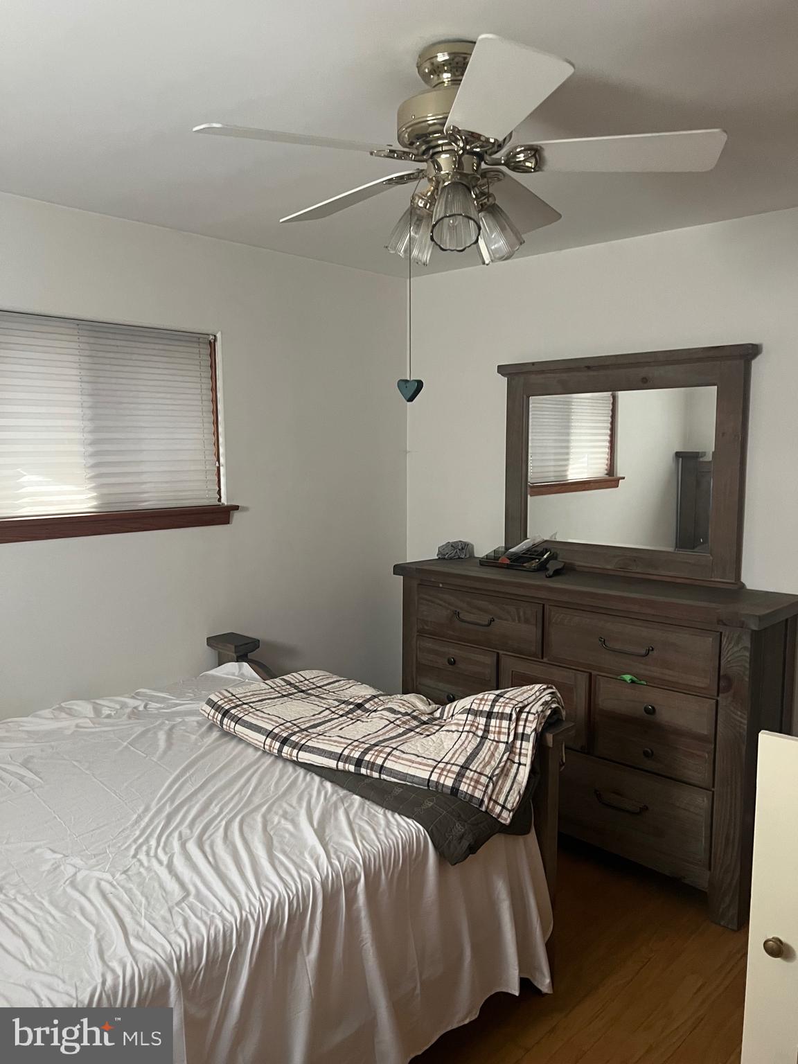 11915 Bedford Road Northeast Cumberland, MD 21502 - Photo 16 of 35 a bedroom with a bed and a dresser