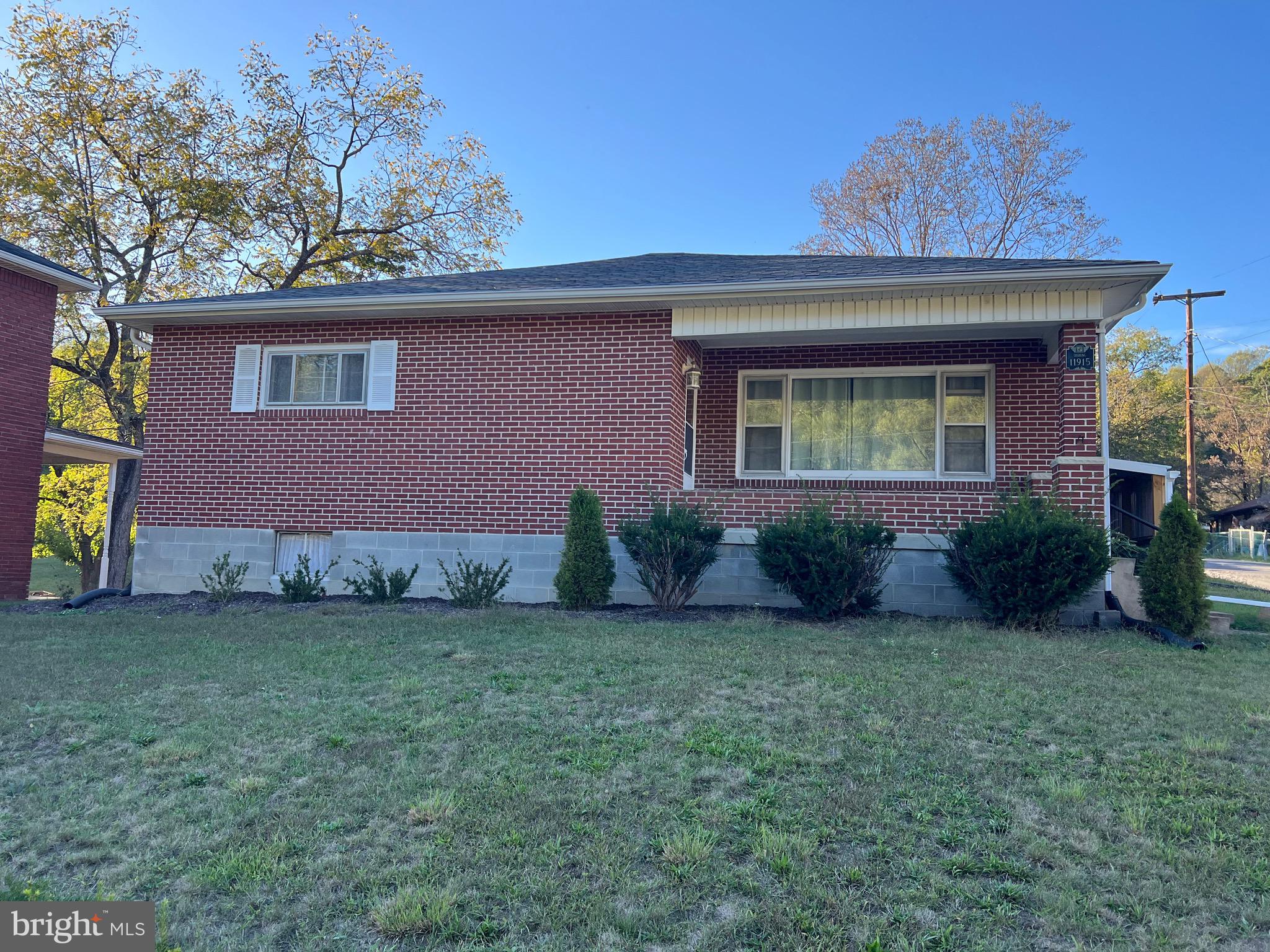11915 Bedford Road Northeast Cumberland, MD 21502 - Photo 2 of 35 a view of a house with a garden