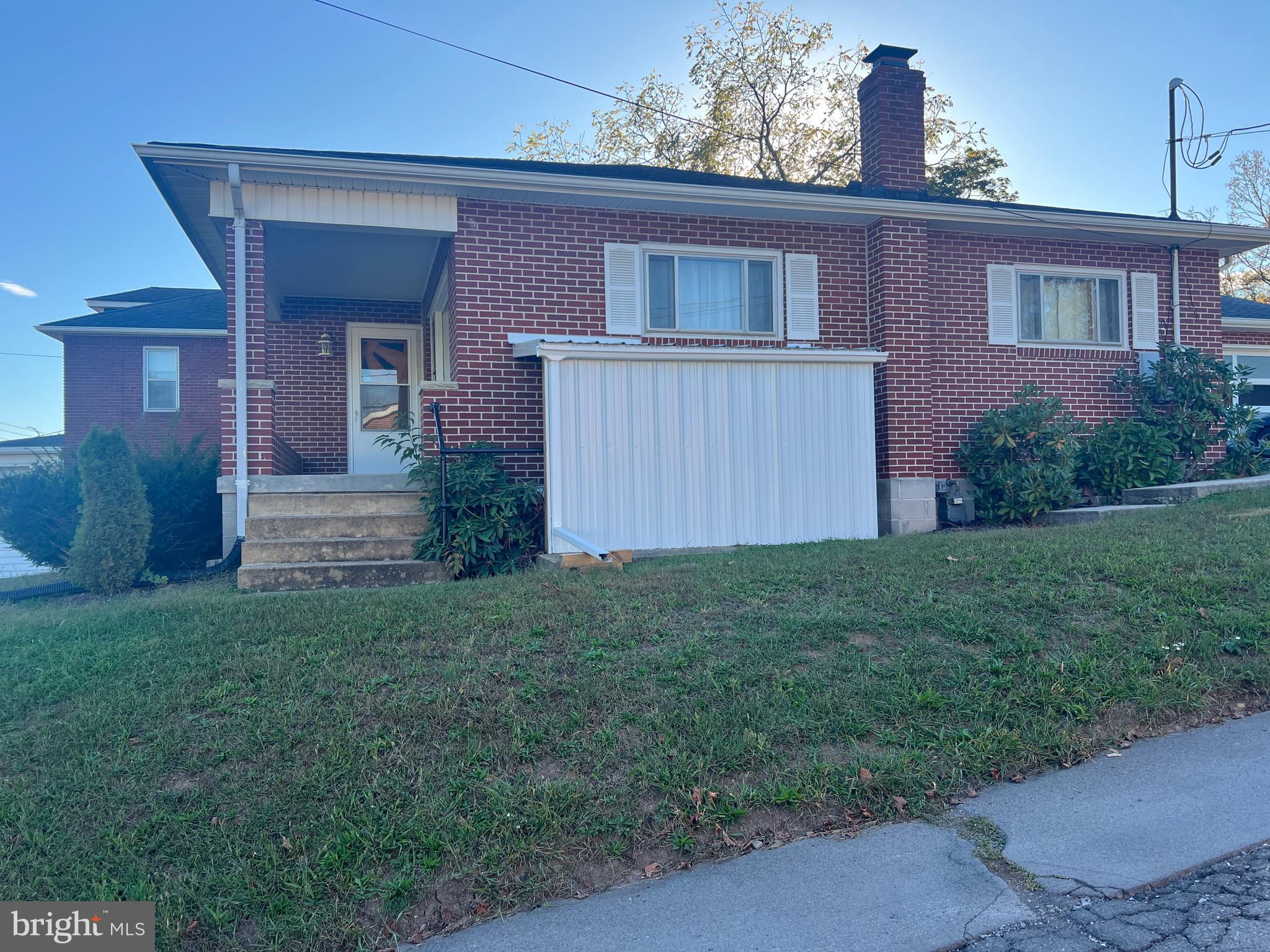 11915 Bedford Road Northeast Cumberland, MD 21502 - Photo 3 of 35 a view of a house with brick walls