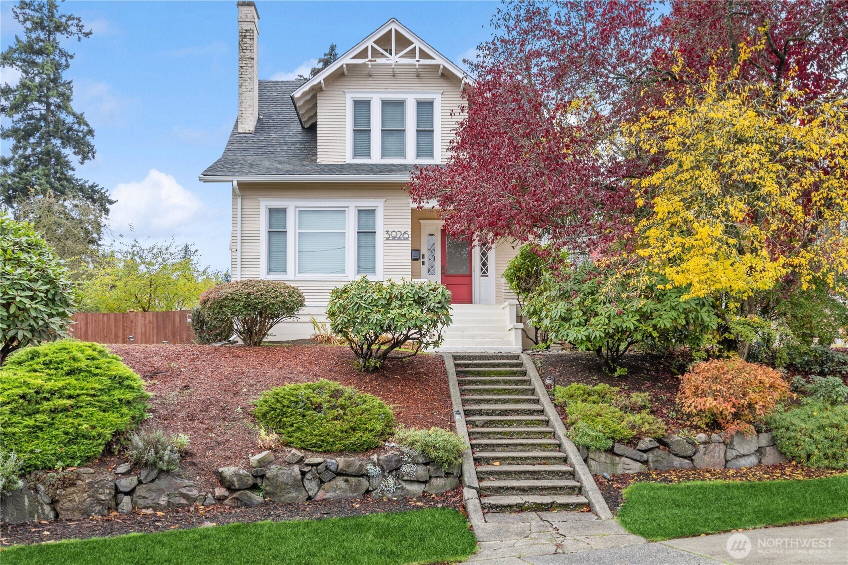 a front view of a house with garden