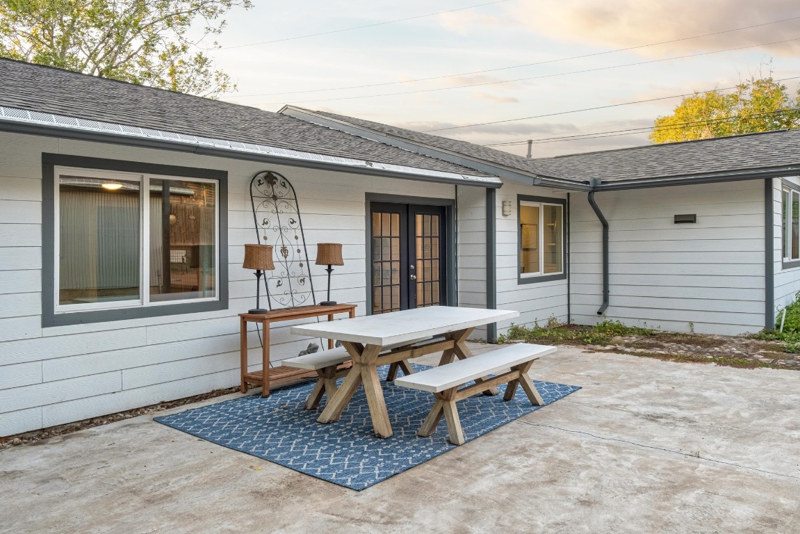 5307 Halmark Drive Austin, TX 78723 - Photo 28 of 31 a backyard of a house with table and chairs